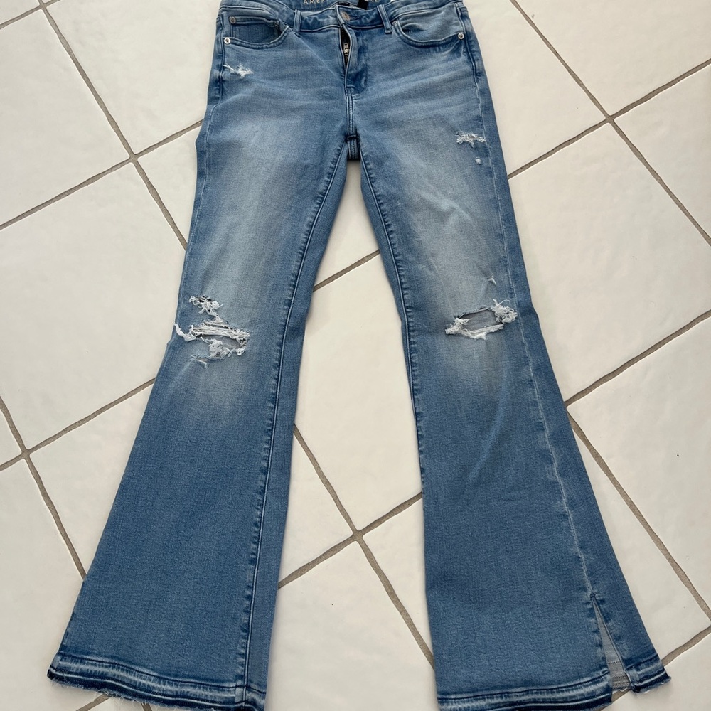 American Eagle Flare Leg Jeans with Distressed Knees and Hem